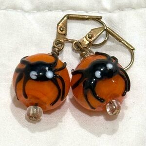 Glass spider dangling earrings